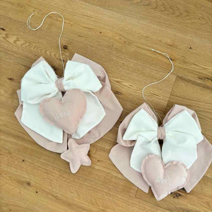 due fiocchi nascita bianchi e rosa con pendente a stella e cuore